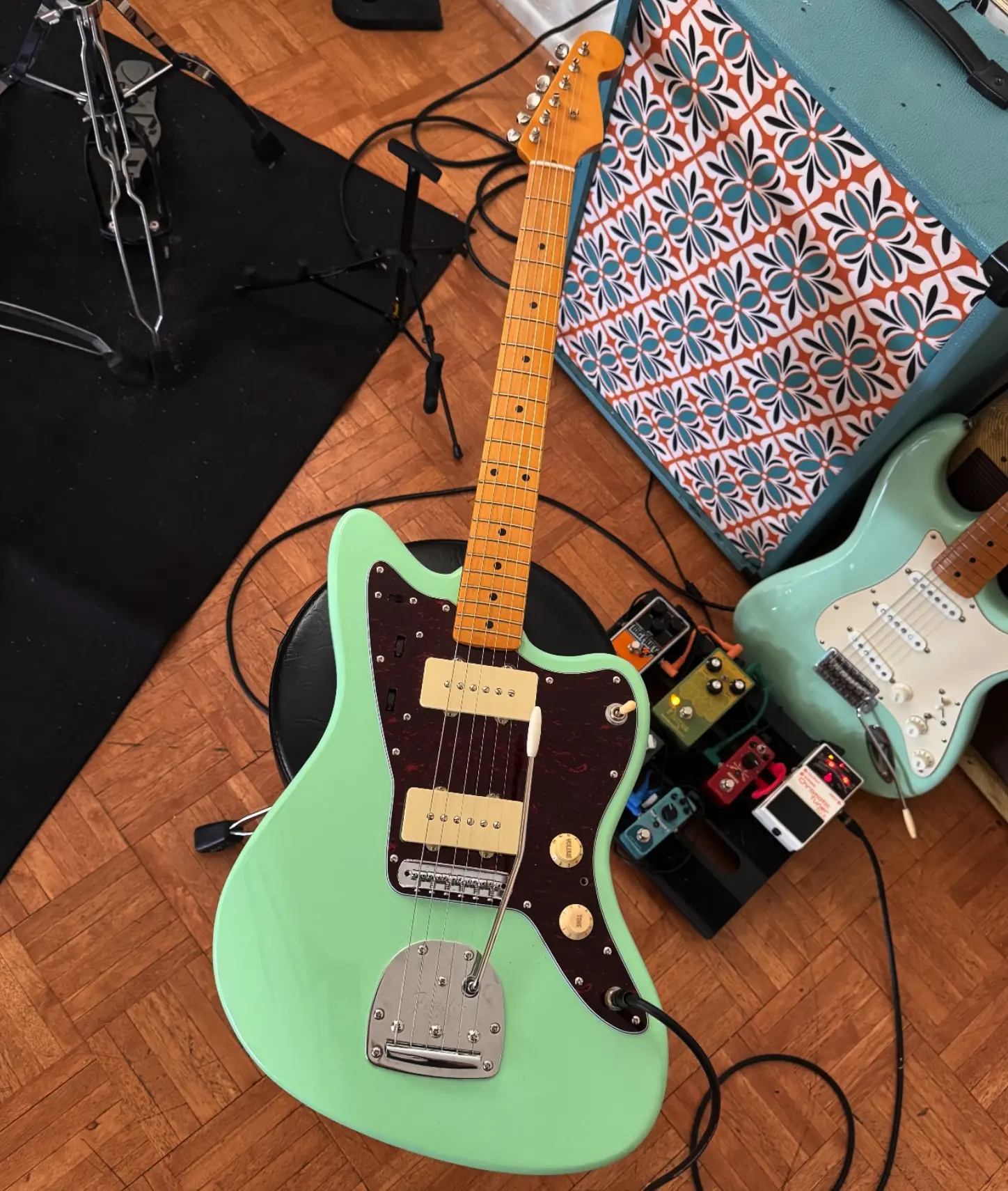 Seafoam green offset guitar before its art transformation